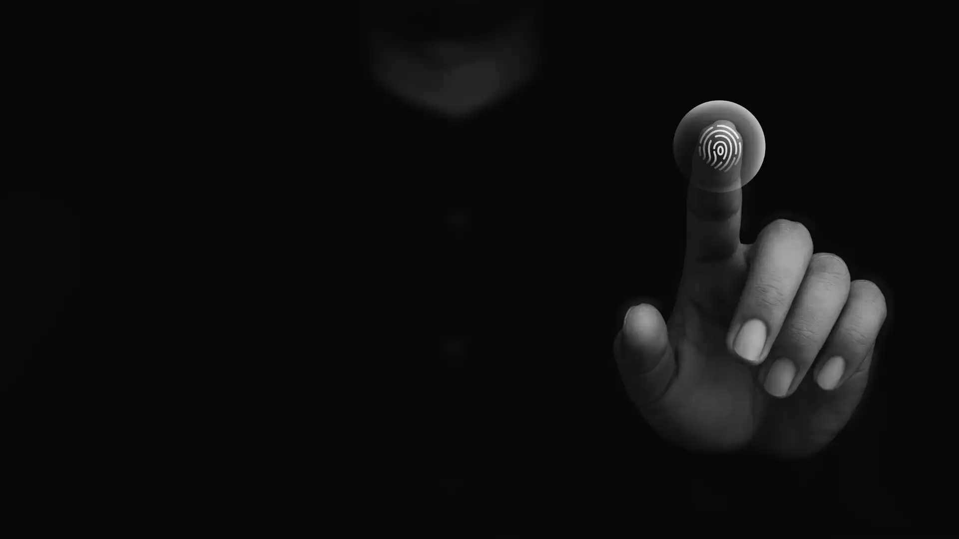 A human finger making a haptic gesture with a digital fingerprint overlay.